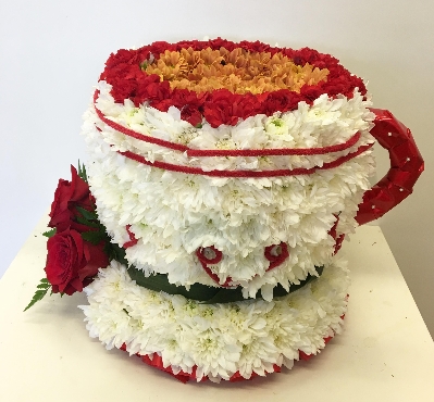 3D cup of tea funeral tribute made with chrysanthemum and spray carnation. 