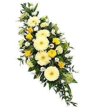 Fresh yellow and white double ended casket spray including roses, germini and carnations. 