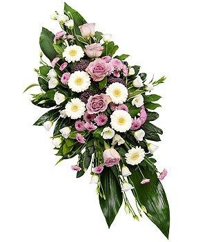 Lilac and white double ended casket spray including roses, germini and carnation. 