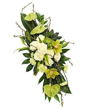 Beautiful mixed modern double ended funeral spray, including roses and orchids. 