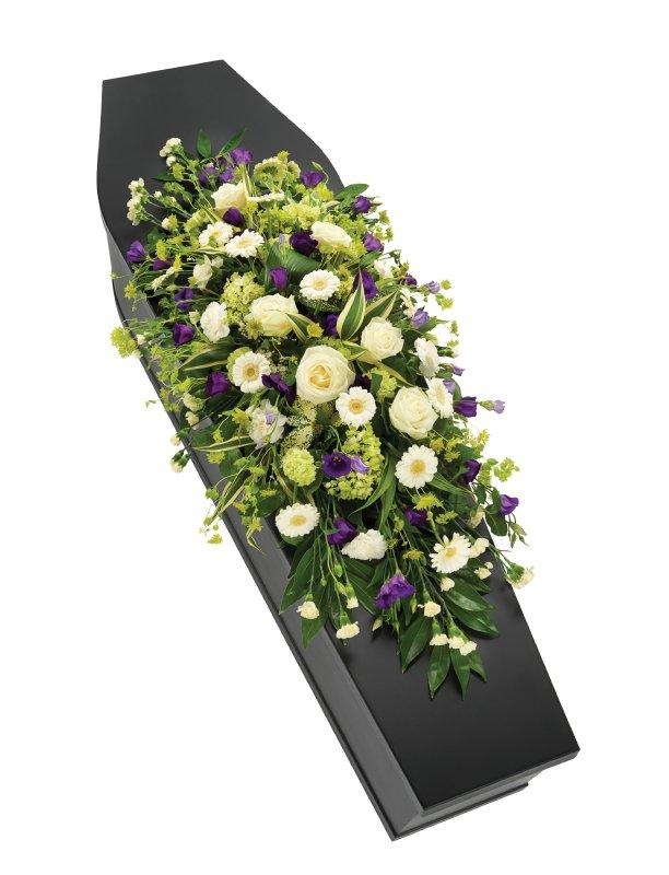 Gorgeous mixed purple and white double ended casket spray including roses, carnations and lisianthus. 