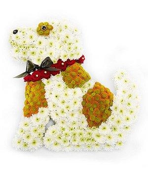 Stunning sitting dog funeral tribute made with chrysanthemum and finished with a red spray rose collar. 
