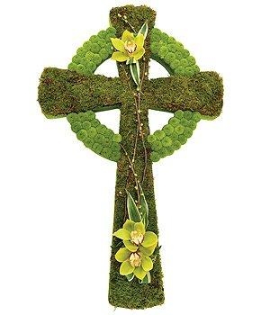 Celtic cross funeral tribute made with massed moss and chrysanthemum. 