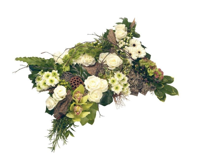 Mixed pillow funeral tribute including roses, carnation, hydrangea and a generous amount of mixed foliage. 