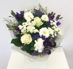 Lovely purple and white mixed bouquet including roses, chrysanthemum and lisianthus. 