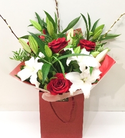 Luxury red rose and white lily bouquet, In our signature cellophane and gift bag.