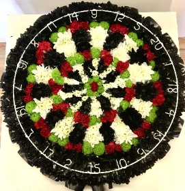 Dart board funeral tribute created with a variety of chrysanthemum and wire numbers. 