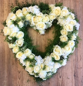 Heart of Manchester funeral tribute made of pure white roses and hydrangea. 
