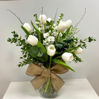 Stunning white bouquet filled with the freshest crisp white tulips and scented stocks finished with mixed foliage and natural birch twigs. Design comes in a modern glass vase and presented in our signature gift bag. 