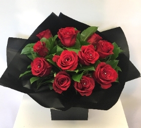 The traditional valentines gift, 12 large headed red roses wrapped in luxury cellophane and matching gift bag. 