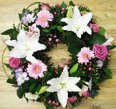 Mixed funeral wreath including roses, germini and lily. 