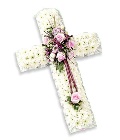 Massed cross with ribbon edge and focal in seasonal flowers.