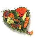Textured loose heart in fiery orange tones and complementary foliage. 