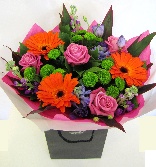 Vibrant mixed bouquet to include roses, germini and other seasonal flowers. 