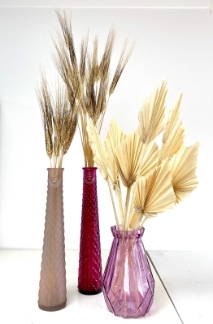 Vase trio in pink tones including natural dried wheat and spear palms. 