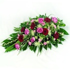 Stunning single ended funeral spray in deep red and pink tones. 