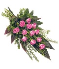 Delicate spray of pink roses and mixed foliage. 